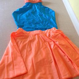 Dance Costume by INSTEP in Size 2.

Lycra sleeveless Leotard in Turquoise Blue has polo neck with stud fastening
and Fluor Orange ribbon back details.

Plus Lycra circular Skirt in Fluor Orange.

As a guide to fit average child of Age 8-10 Years.

In excellent condition, worn once, and from a smoke free home.