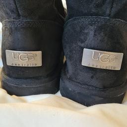 Black Uggs Australia style snow boots with  metal Uggs insignia. in very good condition 1st 2c will buy. Uk 7. I can offer free local delivery within five miles of my postcode or cash on collection as well as postage with extra cost. See photos for condition size flaws materials colour etc. Any questions please ask and I will answer asap. I aim to despatch same day where possible.