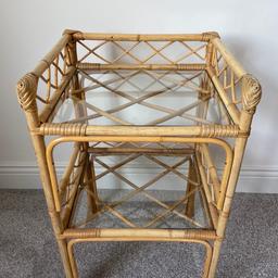 A vintage, cane (rattan) 2 shelf unit, end table.
With glass shelves.
In good condition.
Measuring: 41cm wide, 36cm deep, 69cm high.
Delivery available