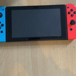 Nintendo switch with Nintendo switch charger also with two games (super smash bros ultimate and 1 2 switch) in good condition. The right thumb stick is off but should not cause problems.