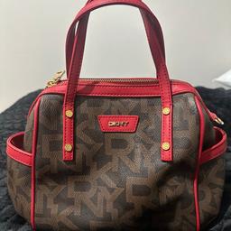 Genuine DKNY small tote handbag in brown / red, condition is like new, everything is still in tact. Great value for price.