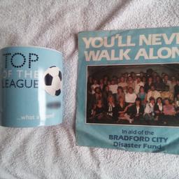 45 record. you'll never walk alone. in good condition.in aid of Bradford City disaster fund. plus football mug.