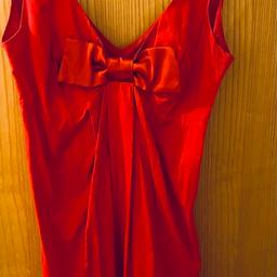 Red dress with a satin bow. Perfect for festive season. It’s size 8 from Asos but I cut off the label. Great condition only worn a couple of times.