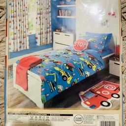Kids brand new duvet set with trucks. Selling due to child grown up