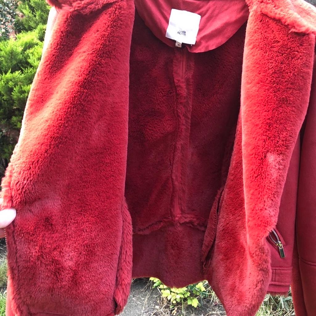 Beautiful River island red aviator jacket. Beautiful suede red jacket with cosy thick full lining to inside . Aviator classic style and details . Great condition was over £80 . Lovely jacket .