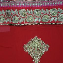 bnwt red saree. very elegant 

embroidery at back of blouse
amazing quality

rrp 75