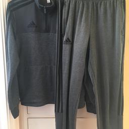 This track suit is in good condition, but the bottoms are slightly different in colour to the top. Pick up only