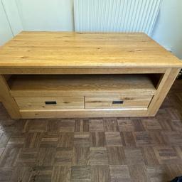 Real Solid Oak TV Cabinet. It has two draws. The width 47 inch, the height is 20 inch and drop is 25 inch. For more please call on 07939461451.