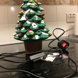 Ceramic pot Christmas tree, has a on off switch, to switch off. Pick up only.