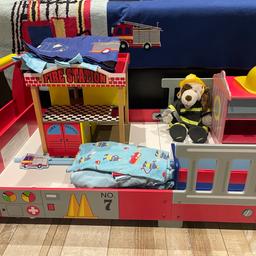 Toddler bed in excellent condition
size 140 cm width x 70 cm depth with lots of fireman accessories to complete a bedroom. Bedside cabinet, bedroom pole, curtains 135 cm x 137 cm (53” x 54”). Rug, shelf, blanket, pole, all bedding including fitted sheets, duvet cover, clock, lamp, bear with fireman outfit, wooden fireman play station with all wooden accessories. All used but in great condition looks gorgeous when all set up. Most items from Next.

No toddler mattress.