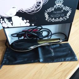 AsaVea heated hair straightener brush. Storage pouch included. Unwanted gift, new. Sill in box.  Reduced!!!