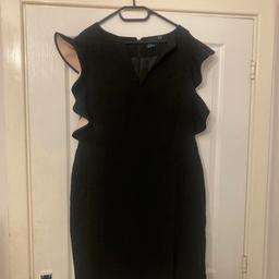 Beautiful black V-necked dress with scalloped short sleeves that have a contrasting inner colour of a pale beige/peach