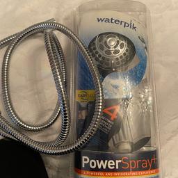 Waterpik shower spray head with pipe used in very good condition
