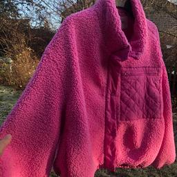Beautiful new teddy coat. More brighter pink than photos show . Bought wrong size and forgot to take back . Was more than this price . Labels still attached. Lovely teddy cosy pink coat with zip up fastening and quilt pocket to front . Really lovely coat .