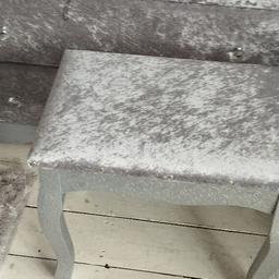here is a lovely silver crushed velvet dressing table stool with chrome studs along the edge has silver pretty patterned legs 

the size 
length 75cm
width 38cm
depth 34cm
if you see on here it's still available