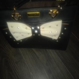 gorgeous Black/white handbag brand new,leather, with brass fittings and diamanti studs! not sure of provenance as it was a gift from an ex! have to downsize as no room.
matching purse available.