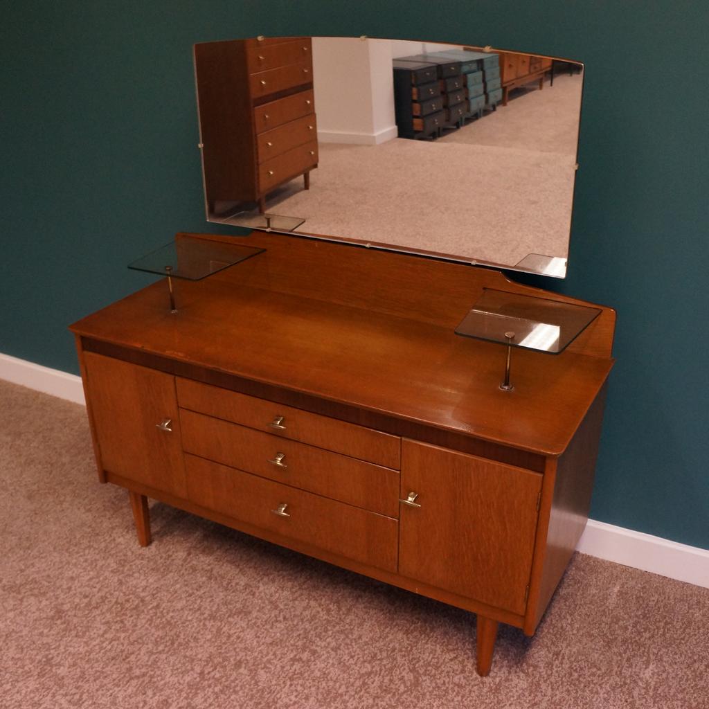 Mid Century Sowerby Bridge

Harris Lebus Dressing Table Original Handles & Mirror

Measurements H124cm x L116cm x D42cm

Collection from Mid Century Town Hall Street Sowerby Bridge, We are happy to liaise with couriers and would recommend Anyvan Or Shiply for quotations.

Please message me to arrange viewings
and check out my other items available

Items may show signs of wear and imperfections due to age