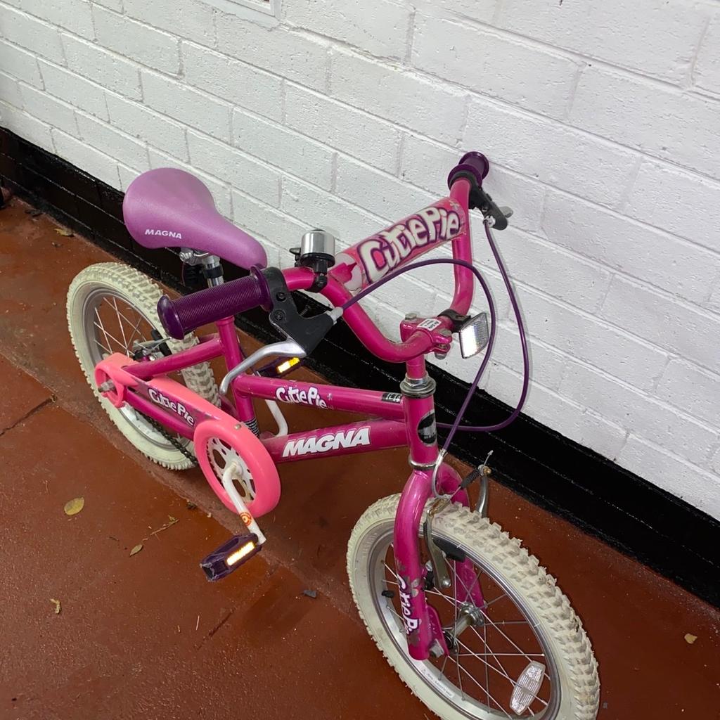 Magna Childs pink bike good condition Height 21”. Length 42” Adjustable seat and handlebars.