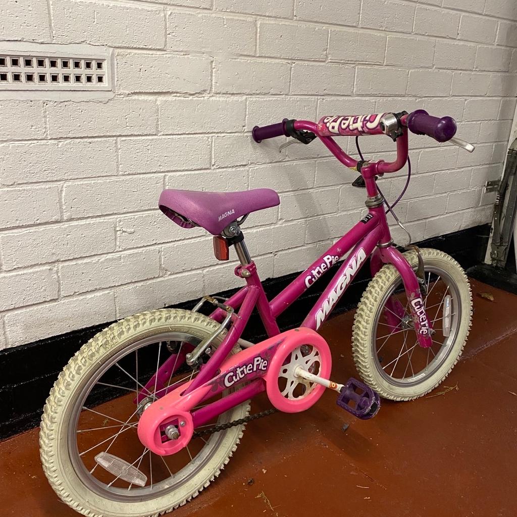 Magna Childs pink bike good condition Height 21”. Length 42” Adjustable seat and handlebars.