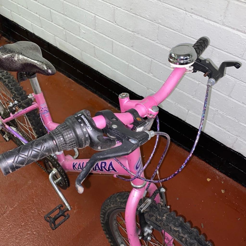 Girls pink bike Saxon Kalutara good condition Height 26” Length 53” Adjustable seat and handlebars.