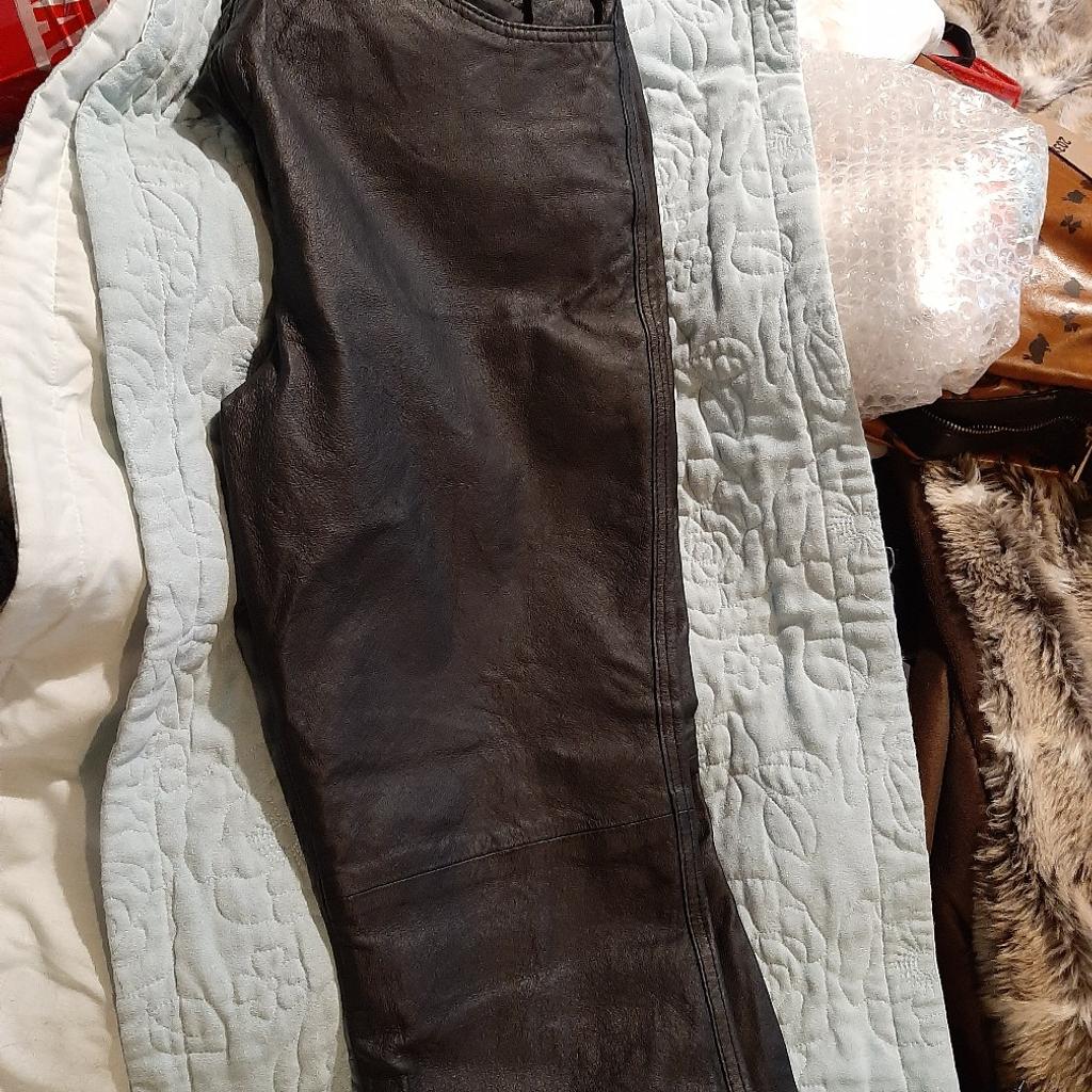 leather look or real leather trousers I can't tell but look leather size 14 good condition apart from a tiny seam of lining needs a needle an thread 2 min job see pics