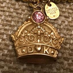Unusual designer Dyrberg Kern large gilt crown deign pendant inset with pink crystal on gold bead very long 36 ins long bead/chain
Stunning and unusual regal pendant
Great gift
£7 o n o