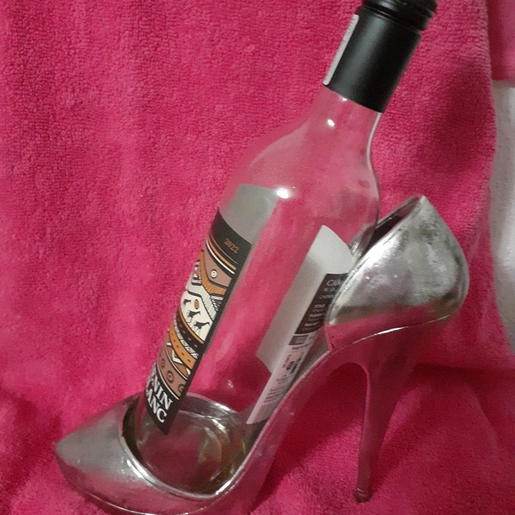 Sexy, silver, novelty, ladies stilletto shoe. Wine bottle holder. Lightweight resin. Looks like metal. Will look ideal on a bar, shop window display, ladies dressing room, let your imagination run wild! Good condition. £8.00. Collection from L11. Thankyou