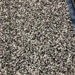 grey and black colour and very thick rug very wide 69 length is 92
