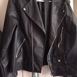 Bought but never worn like new, biker style, has a belt with it.