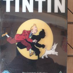 Herges The Adventures of Tintin: Complete Collection DVD (2011) Stéphane Bernasconi.
A five-volume set of adventures featuring Tintin, the world's most famous boy reporter. Together with his faithful dog, Snowy, he journeys around the world, solving mysteries and righting wrongs. All 21 animated adventures (out of a total of 23 comic books) are included: 'The Cigars of the Pharaoh', 'The Blue Lotus', 'Destination Moon', 'Explorers of the Moon', 'The Black Island', 'King Ottokar's Sceptre', 'The Red Sea Sharks', 'Tintin in Tibet', 'The Broken Ear', 'The Crab With the Golden Claws', 'Land of Black Gold', 'The Castafiore Emerald', 'The Seven Crystal Balls', 'Prisoners of the Sun', 'The Calculus Affair', 'Tintin and the Picaros', 'Tintin in America', 'The Shooting Star', 'Flight 714', 'The Secret of the Unicorn' and 'Red Rackham's Treasure'.
DVD set in original box and still with sealed wrapping intact.