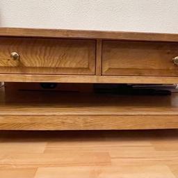 Steady coffee table with two drawers and space underneath for storage.

Has some scratches and chips as seen in photos but otherwise is in good condition.