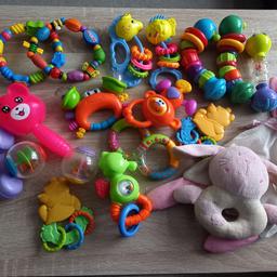 Bundle of rattles  teethers and soft toys.