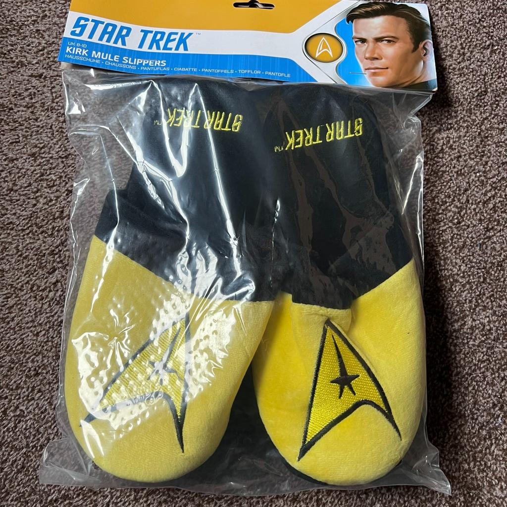 BRAND NEW & SEALED

Treat yourself to an iconic look with these Star Trek Captain Kirk Original Yellow Men's Slippers. Crafted with an official licensed design, these slippers provide an exact replica of Captain Kirk's iconic style and come in a UK size 8-10. Step into intergalactic style and plush comfort with these Star Trek slippers.

Soft yellow slippers with star trek logo across the front.
Perfect to throw on in the mornings or after a long day to keep your feet toasty warm.

CASH ON COLLECTION ONLY
