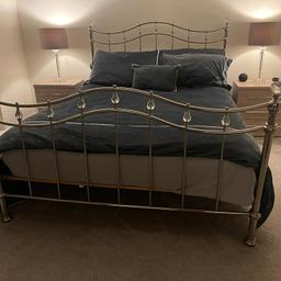 Brushed Chrome king size bed excellent condition. Has a slatted base which provides lasting support offer as original price £695.00 Also as an addition i have added a strip Gouvee lights under the bed very affective and attractive for all occasions happy to throw these in with the price of the bed frame