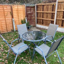 4 chairs with a glass tabletop feature. Very hard wearing set as been used for years with minimal wear and tear. No parasol included.