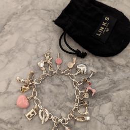 Genuine Links of London charm bracelet sterling silver 925 + 16 Charms
Excellent condition. As shown in images. Item in fantastic condition and with original bag, no box supplied. All hallmarked.
#valentine