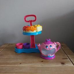 vtech interactive tea set, lights up and has musical features. Comes with tea cups and cakes/cake stand as seen in pictures
