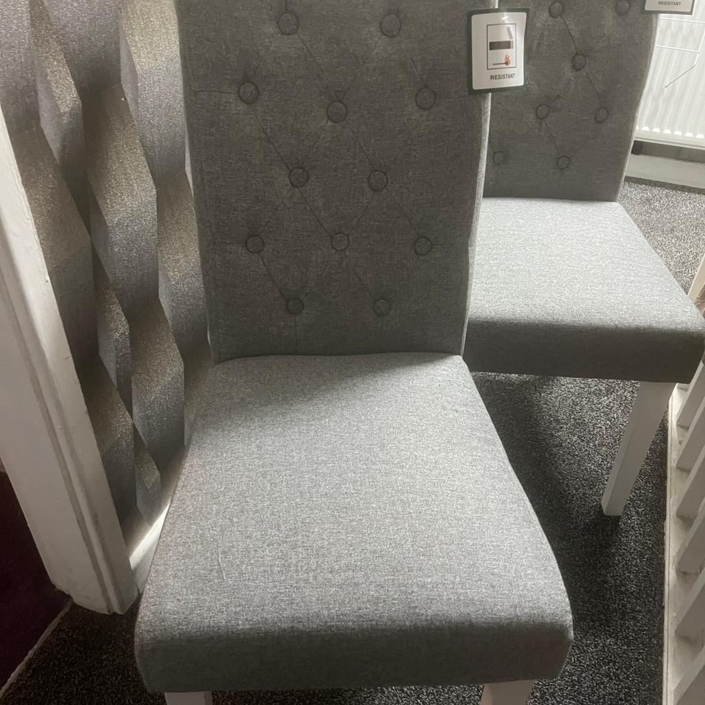 Brand new dining chairs. 2 grey chairs. Can deliver for a small fee