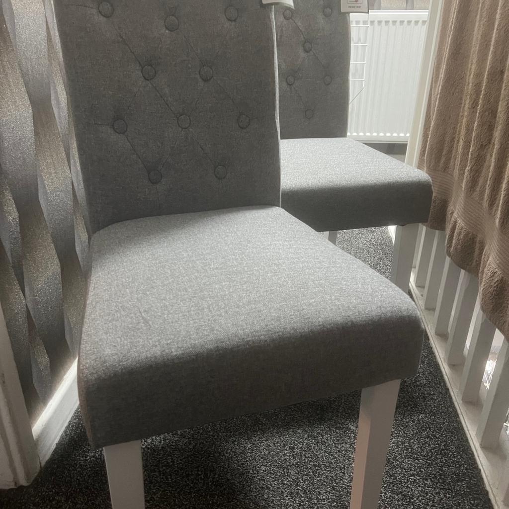Brand new dining chairs. 2 grey chairs. Can deliver for a small fee
