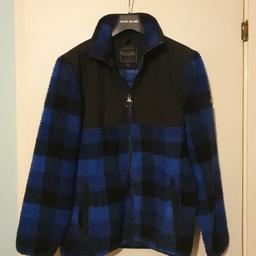 Regatta outdoor fleece jacket.
Blue and black checked design on fleece. Very little use as too small, so is in excellent condition. 2 outer pockets. Elasticated cuffs.
Ideal windbreaker jacket for outdoors.