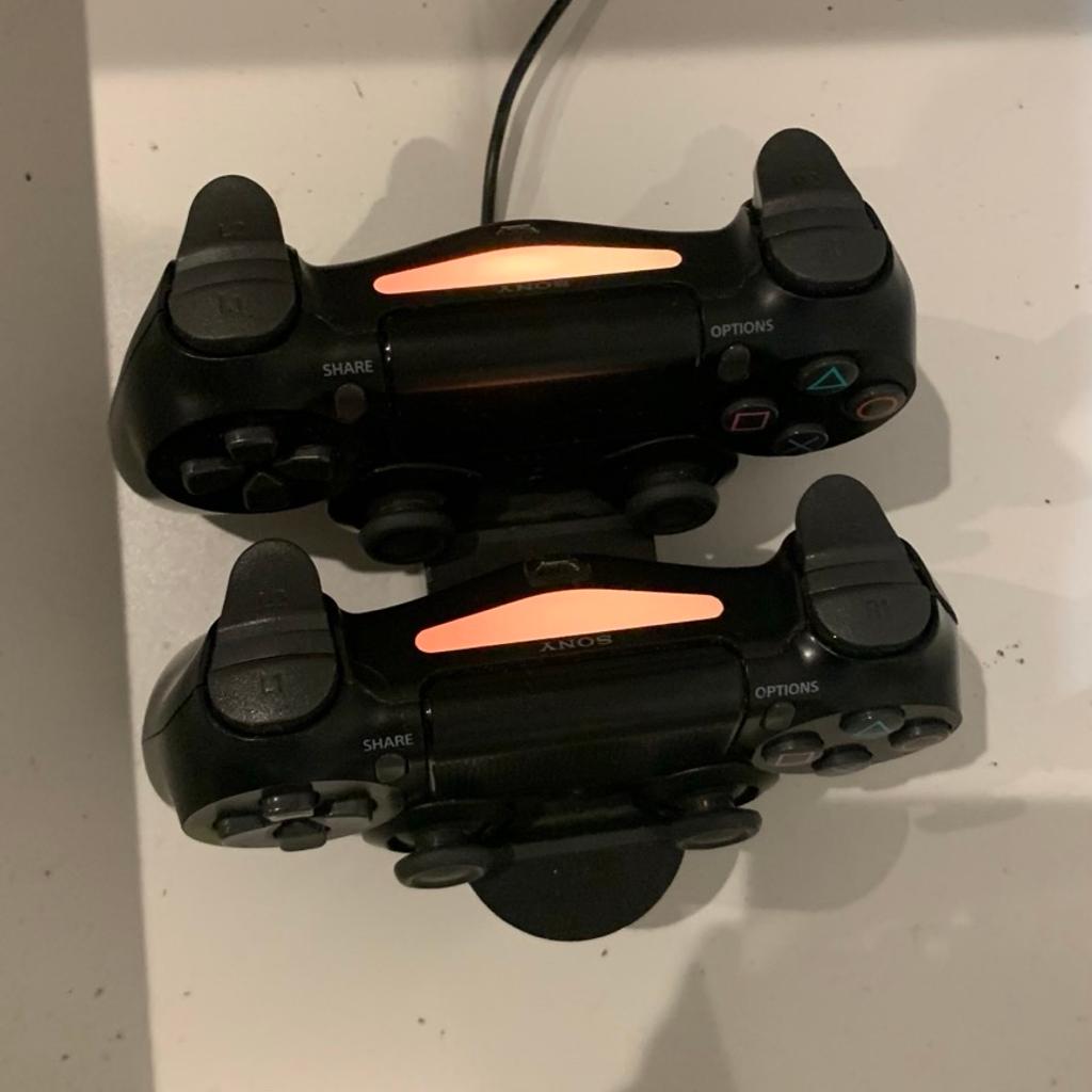 This is a Playstation 4 Slim 500GB that works perfectly working and has no defects apart from light scratches around the body and no actual dents.
The two Dualshock 4 controllers that this comes with both work perfectly fine and all buttons work, there are only light scratches on the bottom where the charger goes.
The charging dock works fine and can charge both controllers within 30 minutes from zero to full.