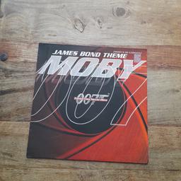 1997  12" single  mixes  by Moby   Tomorrow never dies with 3 mixes ,  vinyl in good condition cover has slight wear around edges