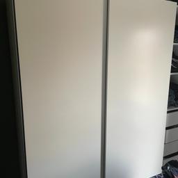 Ikea PAX wardrobe (bought for £475) - good as new,  barely used. 
Two larger sections with sliding doors and rails for clothes. One add-on smaller open section with shelves and drawers. 

Components:
KOMPL N drawer 50x58 white x4 
KOMPL shelf 50x58 white x3 
KOMPL clothes rail 75 white x4 
KOMPL N soft clos dev 2-p x1 
PAX wrd frm 50x58x201 white N x1 
PAX wrd frm 75x58x201 white N x2 
HASVIK NN slid doors pair 150x201 white x2