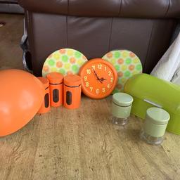 Kitchen set includes bread bin, c,t and sugar canisters .clock, lamp shade and 2 glass chopping boards. The colours look great mixed together. Collection only from Bromsgrove B61
