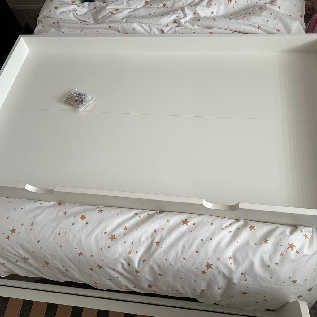 Used mamas and papas cot/cot bed.

There are several marks in the cot bed from general wear and tear. Mostly my daughter putting stickers on her bed.
The bed is currently built as a cot bed but it also has sides to turn into a cot.
It also comes with an under bed storage draw on wheels.
Still got the instructions so you can rebuild. Will be flat pack when bought for storage reasons.
Collection only from EN4 area