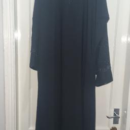 Ladies black full length Abaya/Jubba / Jilbaab / Burka dress
Black shiny diamante details on the front neckline, back, sleeves and on the bottom edge. Heavy material very flattering. Has had asjustments made to extend the bust area as seen in the photo. Also has pocket.
Size M
Bust: 23"
Length: 54"
Sleeve length: 20"
Excellent used condition 

Smoke free home
All measurements are approximate.
All items of clothing (used) should be washed before use. Some items have been in storage.
Please take a look at my other items.
Collection Preferred from B23 or B9
£18 ono