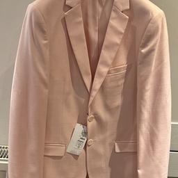 Pale pink slim fit style blazer. New with tags. From M&S. Beautiful palm tree lining. Lining photo and front photo pick up the colour the best. It’s a shell pink so difficult to photograph. 

Perfect for a prom, wedding or party. 

RRP: £40

Machine washable
Tumble dry

Pet and smoke free house.