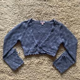 Gorgeous cornflower blue crochet cardigan with subtle sequin detailing. This is a size 4-6 however I would be surprised if it fit a 6 year old. Brand new, just without tickets. 

100% cotton
Hand wash 

Pet and smoke free house.