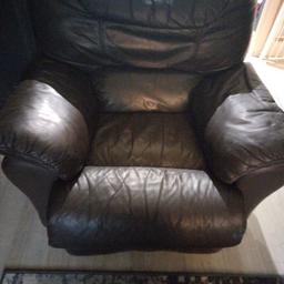 Brown leather reclining chair slight tear as shown in second pic