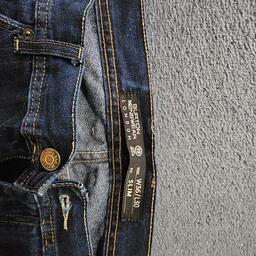 Navy Blue Burton Jeans
Detailed stitching
Slim fit